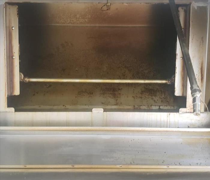 Grease inside a stove vent before cleaning 