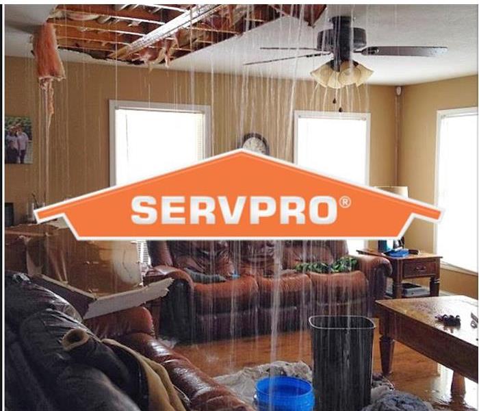 SERVPRO logo with water coming out of ceiling 