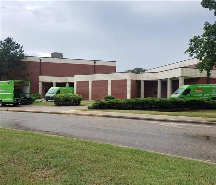 High School with SERVPRO vehicles out front 